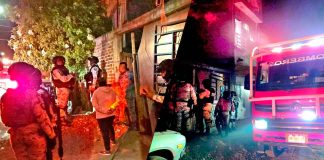 Oficiales de Guardia Nacional auxilian a familia durante incendio, en Zamora