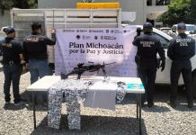 GC detiene a dos hombres en posesión de fusil, cartuchos y droga sobre la México-Guadalajara