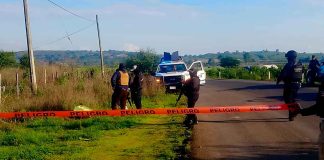 Abandonan ejecutado junto con un narcomensaje, en Tangamandapio