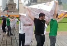 De la fiesta a la polémica: aficionados desatan críticas por usar lona de desaparecidos como paraguas