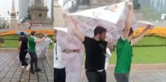 De la fiesta a la polémica: aficionados desatan críticas por usar lona de desaparecidos como paraguas