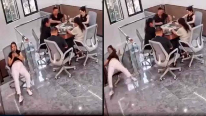 mujer-cae-escaleras-silla-oficina-distraida-celular-video