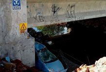 Dos muertos y tres lesionados deja volcadura de automóvil en la Autopista de Occidente